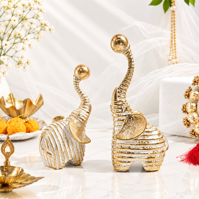 Set of 2 White & Gold Textured Resin Trunk Up Elephant Figurines, Decorative Tabletop Accent Statues for Home Decor (21x9 cm)