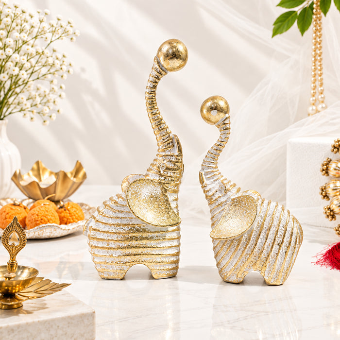 Set of 2 White & Gold Textured Resin Trunk Up Elephant Figurines, Decorative Tabletop Accent Statues for Home Decor (21x9 cm)