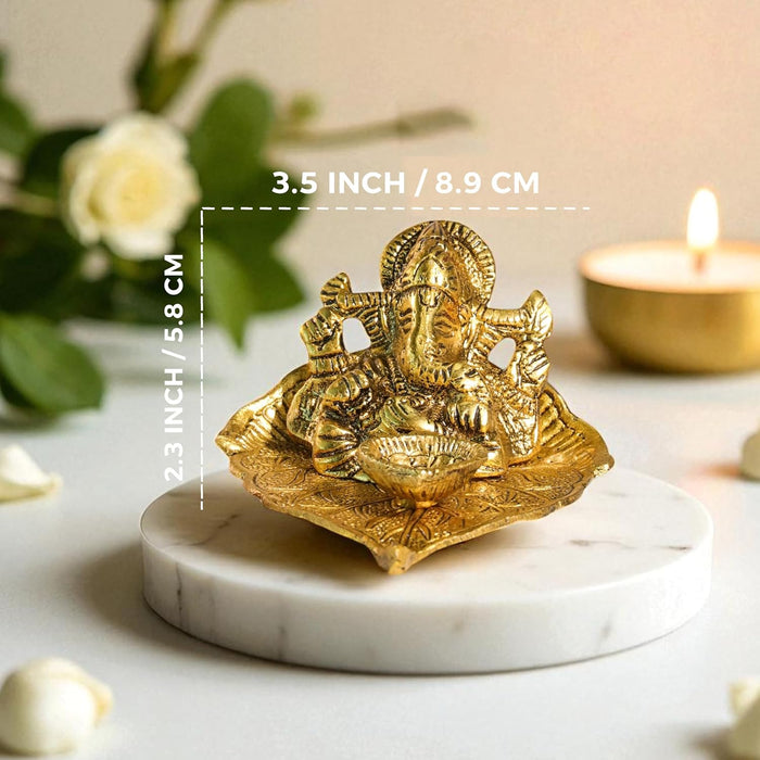 Mental Ganesha Idol on Peepal Leaf with Diya Oil Lamp, Diwali Pooja Decoration Items, Brass Finished Idols for Deepawali Decor Oil Lamp 8.9x5.8 cm