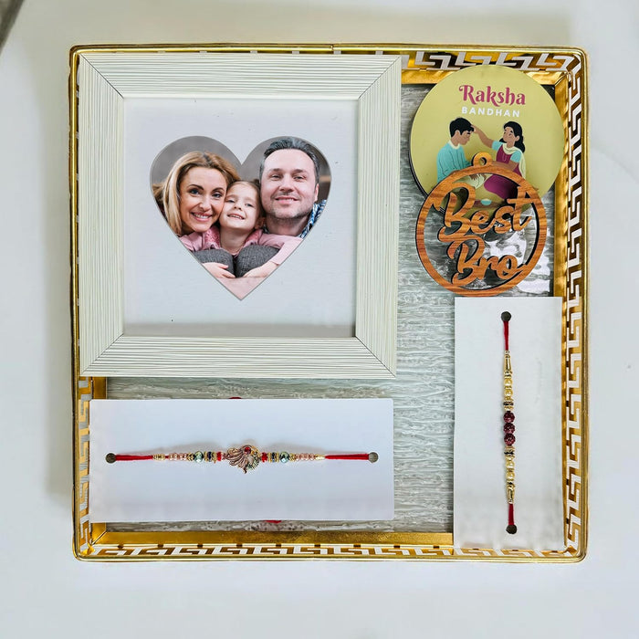 Art Street Rakhi Gift Hamper Combo Set -Two Rakhi for Brother, Best Bro Keychain, One 5x5 Inch Photo Frame with Heart Shape, Square Shape Tray, Three Fridge Magnets